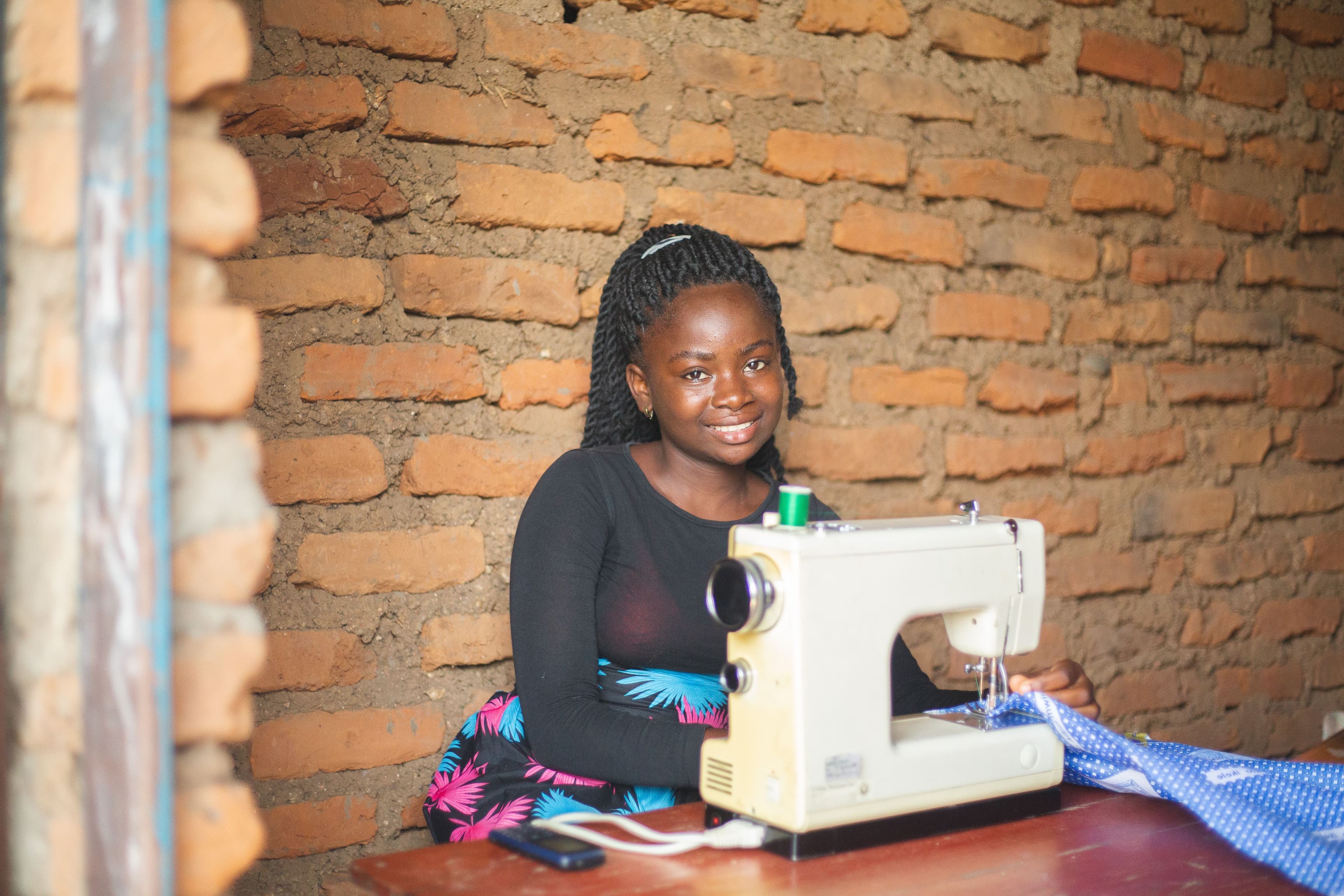 Small business owner working at a sewing machine